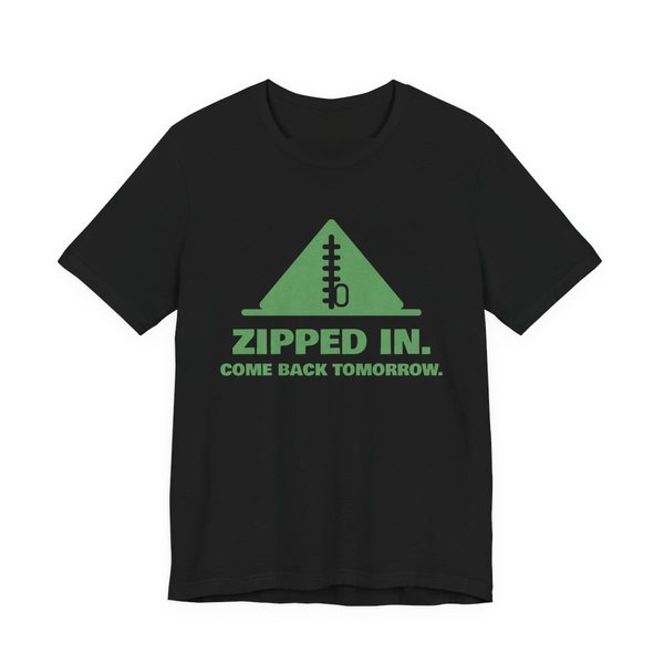 Black t-shirt printed in pine green ink with a zipped-up tent and the words “Zipped In. Come Back Tomorrow.”