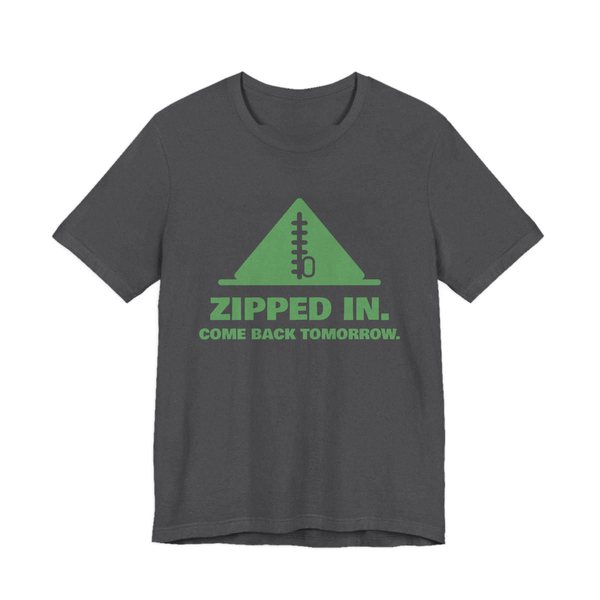 Dark Grey Heather t-shirt printed in pine green ink with a zipped-up tent and the words “Zipped In. Come Back Tomorrow.”