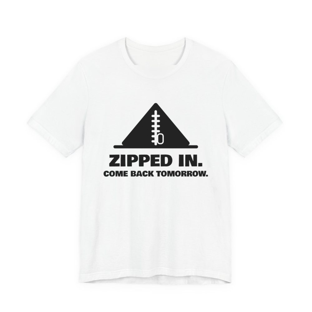 White t-shirt printed in dark ink with a zipped-up tent and the words “Zipped In. Come Back Tomorrow.”